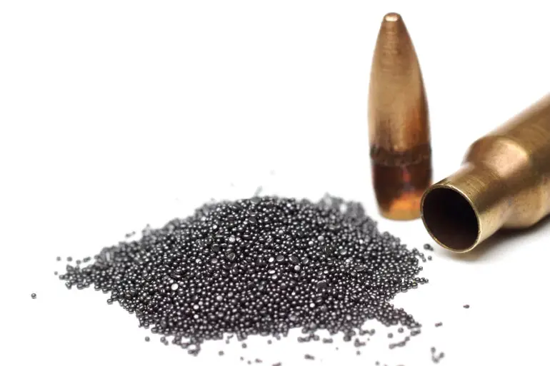 A rifle bullet with gun powder isolated